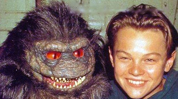 A young Leonardo DiCaprio standing next to a puppet on the set of the movie Critters 3.