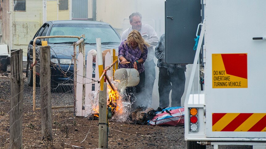  Property owners who lost their home put out flames after some belongings in a trailer caught fire in the South Australian fires