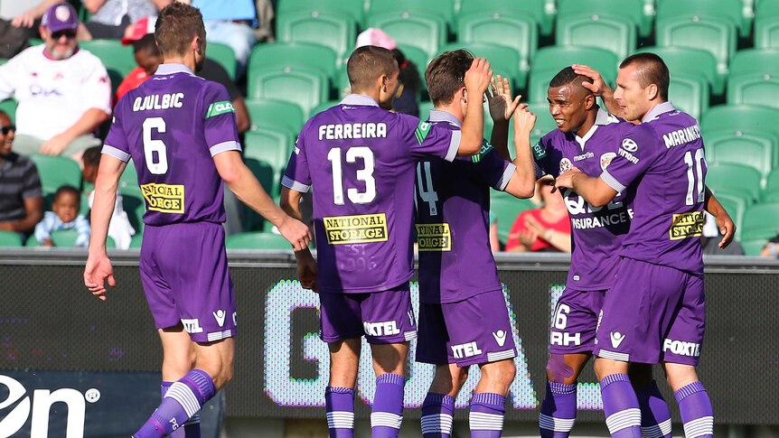 Sidnei Sciola celebrates with Perth Glory team-mates after his goal against Adelaide at Perth Oval.