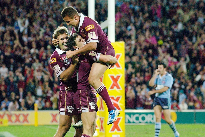 Billy Slater mobbed by Maroons teammates after try in 2004