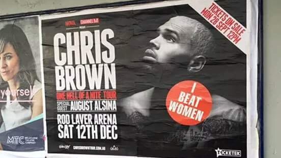 "I Beat Women" sticker placed on Chris Brown concert promotion poster