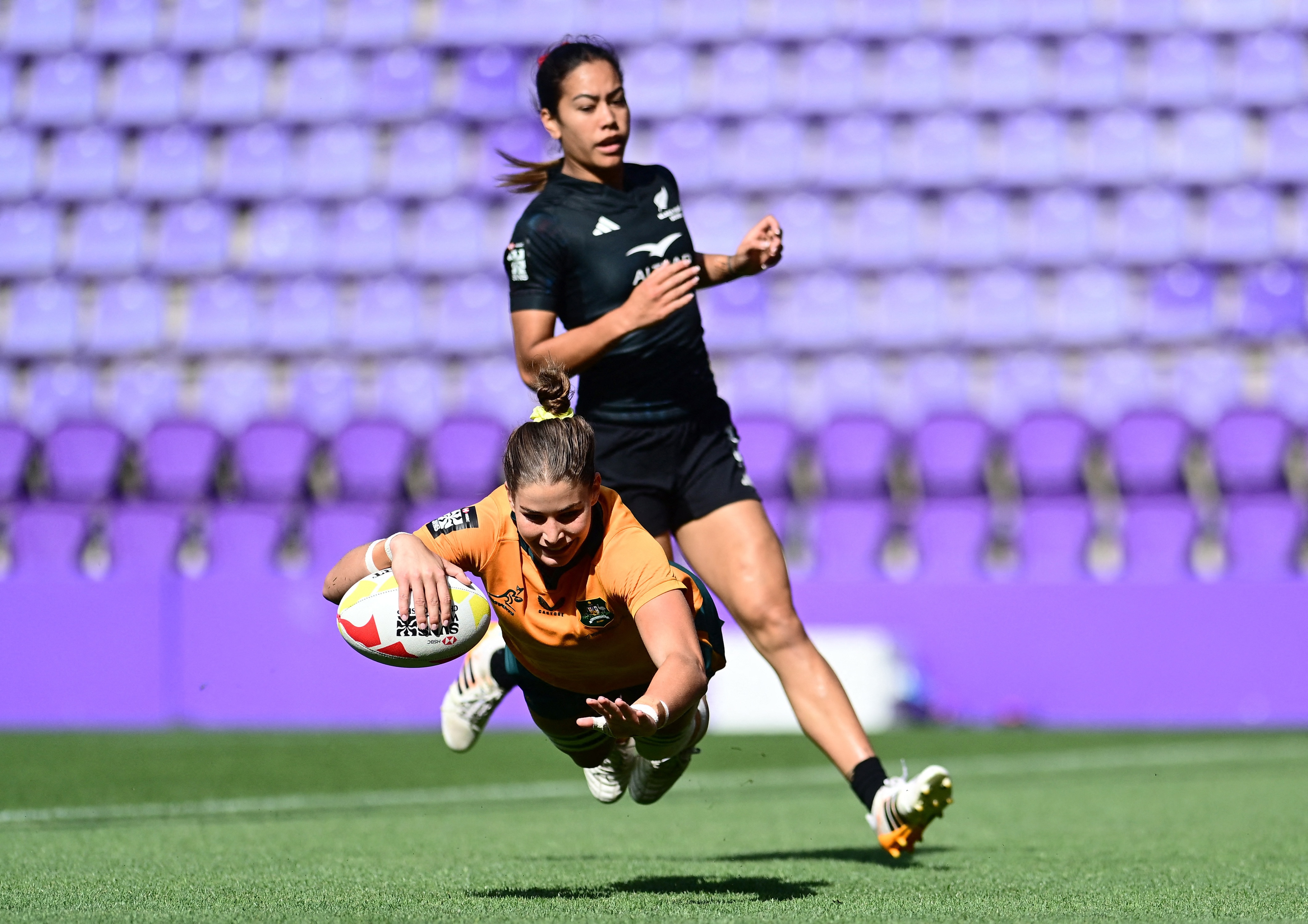 Kaitlin Shave scores a try for Australia against New Zealand at the rugby sevens World Championship in Spain.
