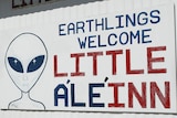 A sign at the the Little A'Le'Inn, saying eathlings welcome