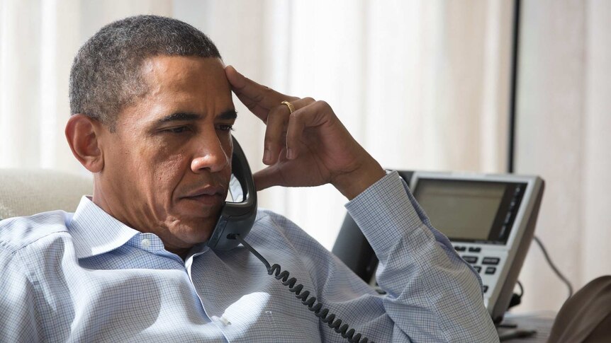 US president Barack Obama speaks on the phone