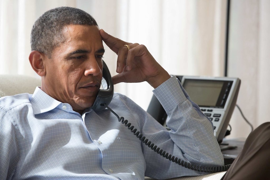 US president Barack Obama speaks on the phone