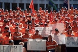 More than a hundred workers on the steps of Treasury building Melbourne.