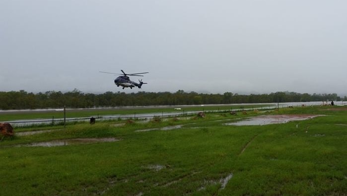 A helicopter lands at Daly River.