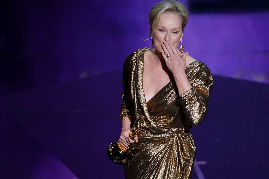 Meryl Streep blows a kiss to the crowd after winning the Best Actress Oscar