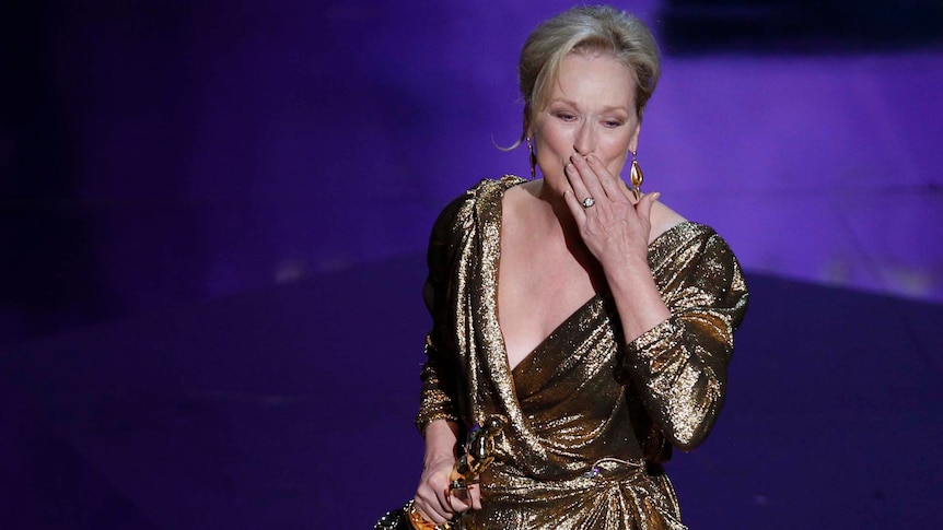 Meryl Streep blows a kiss to the crowd after winning the Best Actress Oscar