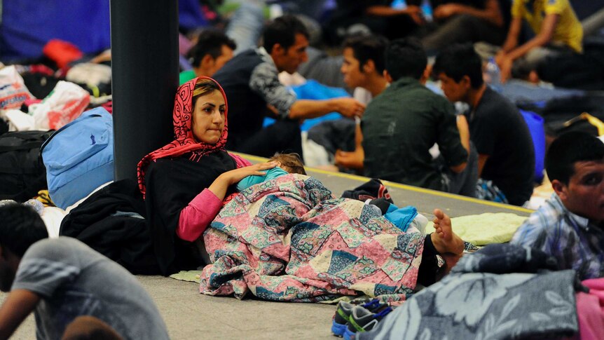 Migrants wait to leave Hungary