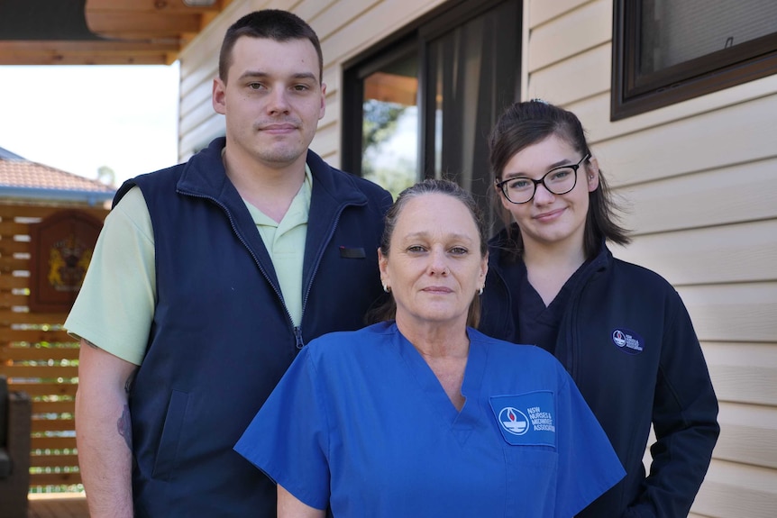 Nurse Michelle Rosentreter stands with her son James and her daughter Tarna.