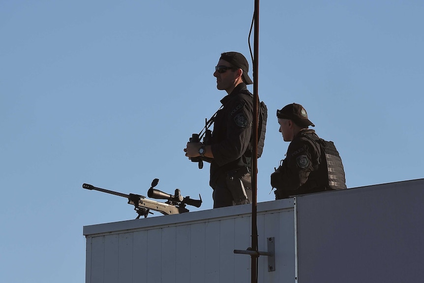 Snipers on top of a building.