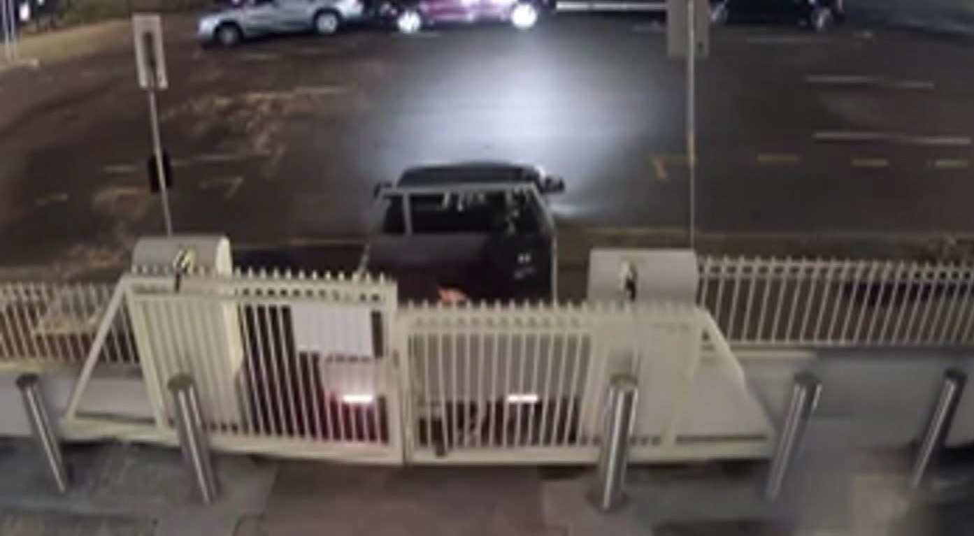 CCTV still of a ute reversed into a gate