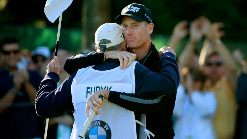 Jim Furyk celebrates with his caddie Mike 'Fluff' Cowan after shooting 59 at the PGA Tour playoffs.