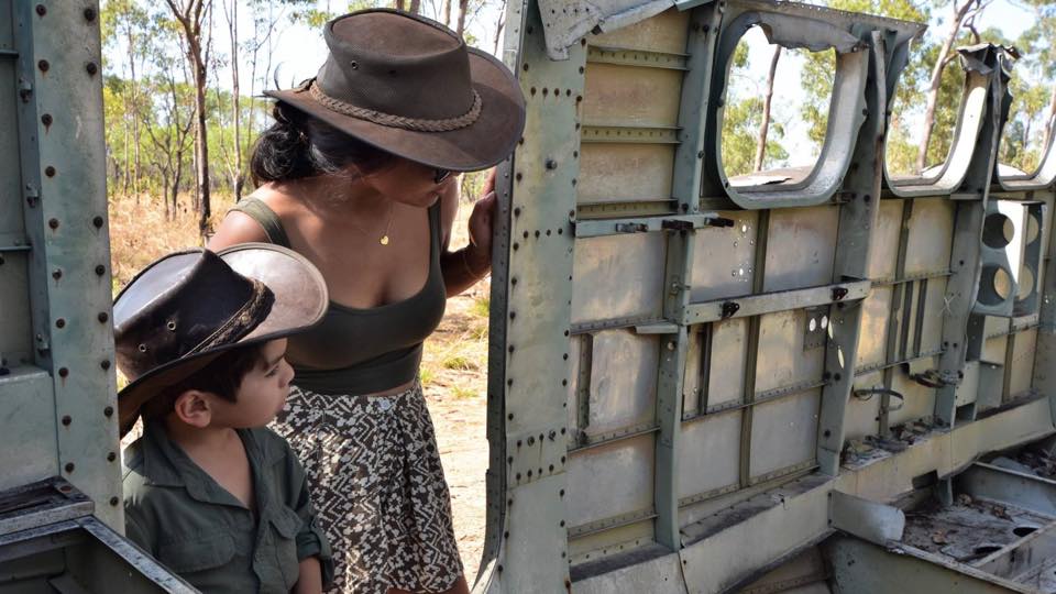Tourists inspect the wreck of a WW2-era plane that crashed near Kalumburu, in WA's far north.