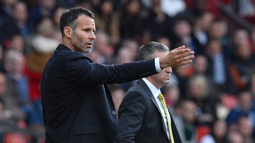 Winning start ... Ryan Giggs instructs Manchester United from the sidelines