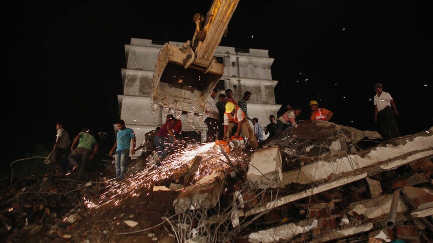 Rescuers search for survivors of building collapse in Mumbai