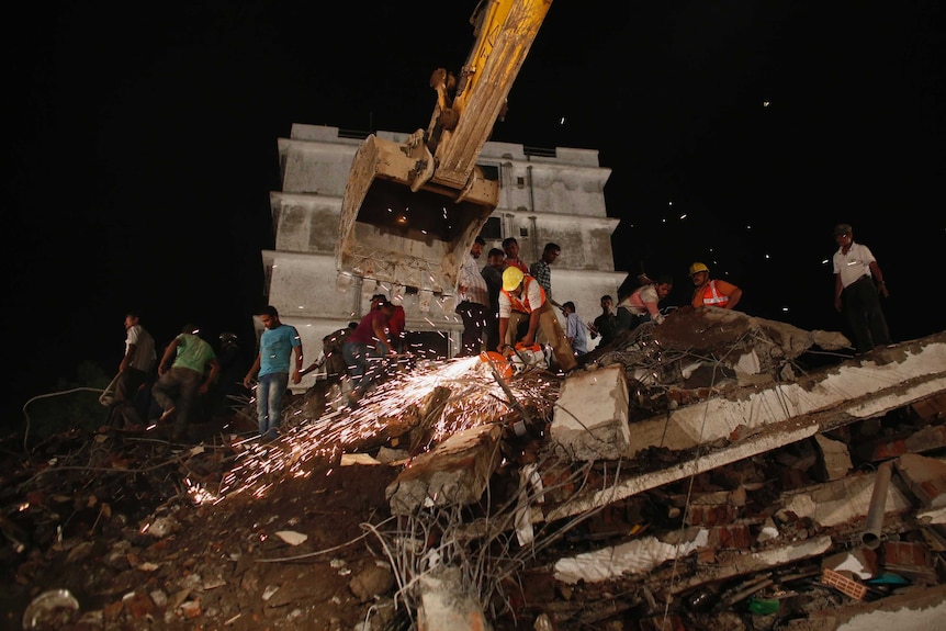 Rescuers search for survivors of building collapse in Mumbai