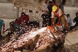 Rescuers search for survivors of building collapse in Mumbai