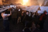 Egyptian protesters take cover during clashes