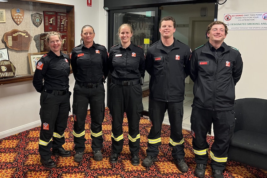 A group of five female firefighters.