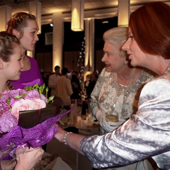 A photo of Charli Moore meeting Queen Elizabeth II and Julia Gillard after performing in the Australia Girls Choir