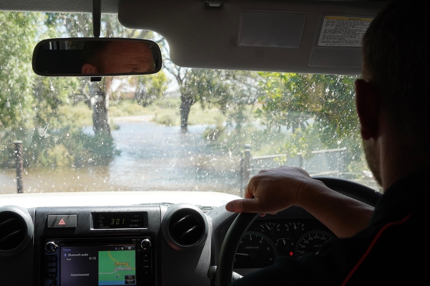 The view from a car amid flooding.