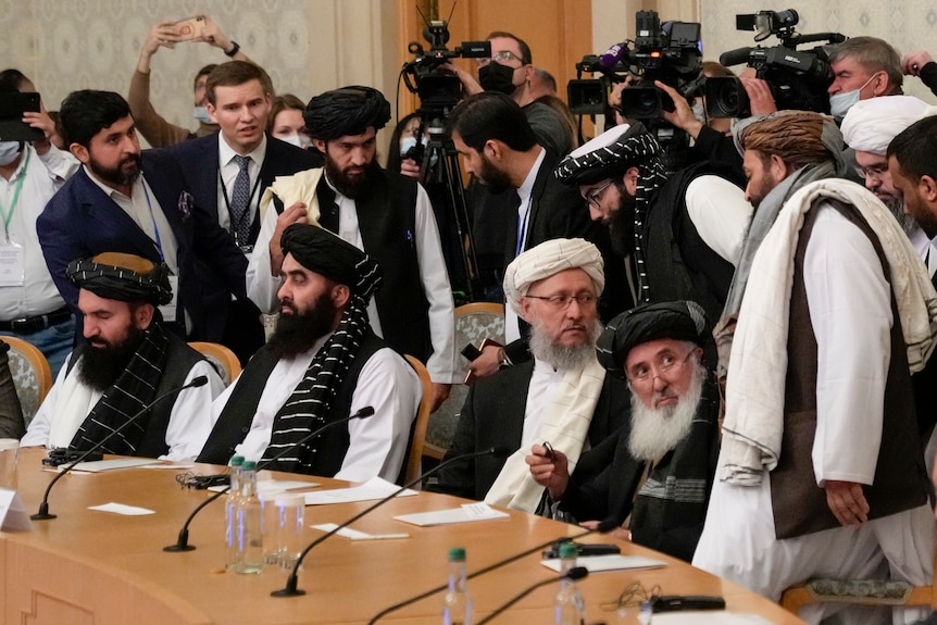 Taliban officials sit at a rounded table in Moscow.