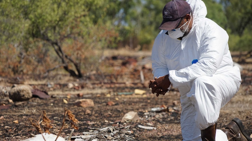 A Traditional owner in Barunga inspects asbestos in Barunga.