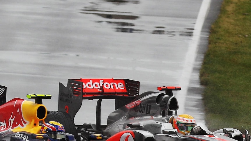 Lewis Hamilton (R) ended Red Bull drivers Mark Webber (L) and Sebastian Vettel's streak of pole dominance. (file photo)