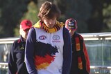 A disappointed Crows fan walks away from Adelaide Oval.