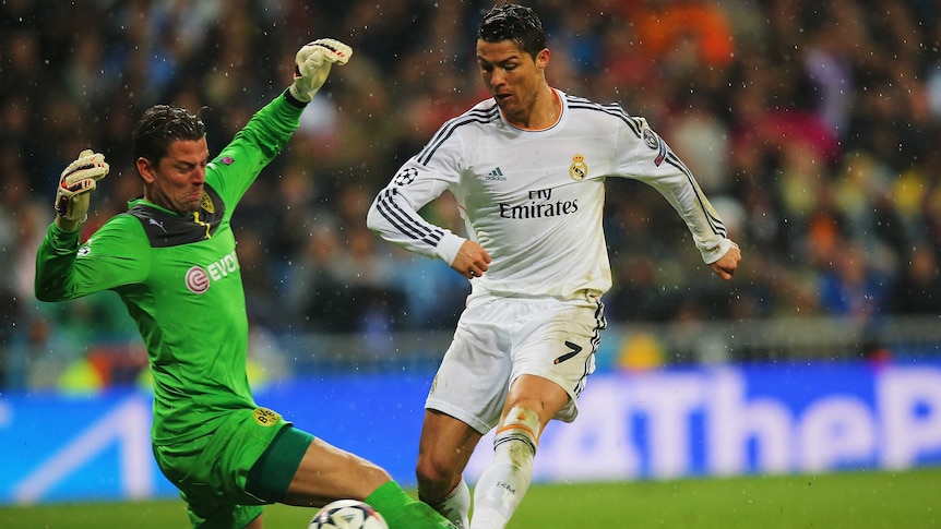 Real Madrid's Cristiano Ronaldo scores against Borussia Dortmund in the Champions League.