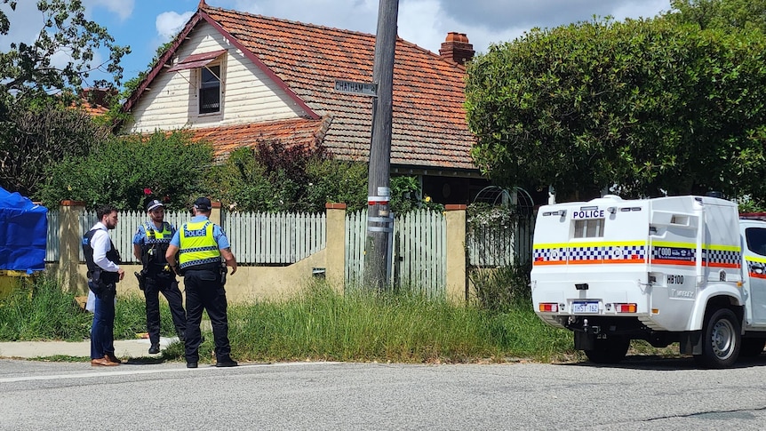 Officers and a police car on a street in Woodbridge.