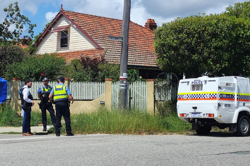 Officers and a police car on a street in Woodbridge.