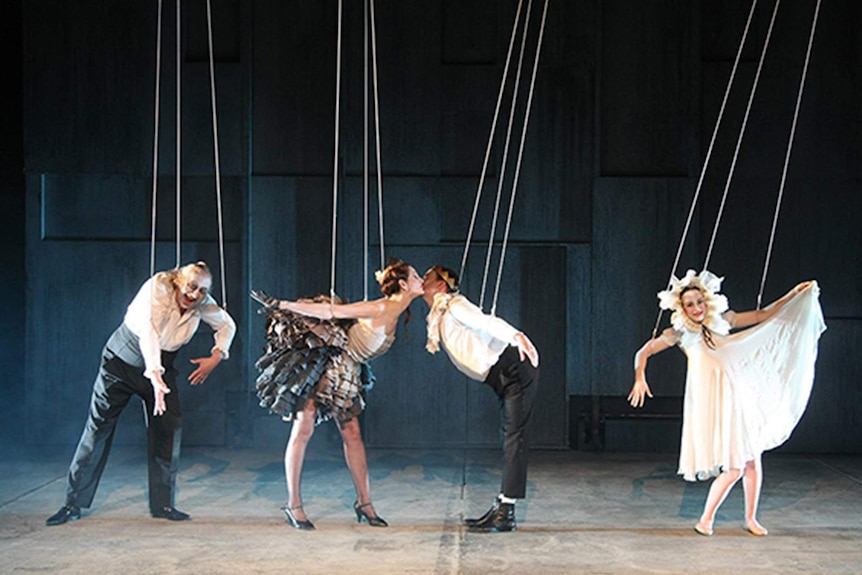 Actors attached to strings perform Hamlet.