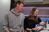 Michael Basson, Bethany James and baby Rowan in their kitchen