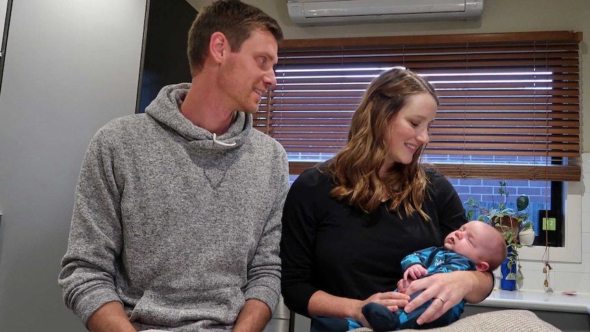 Michael Basson, Bethany James and baby Rowan in their kitchen