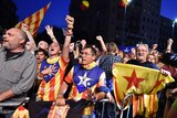 Catalan pro-independence supporters cheer after polling stations close