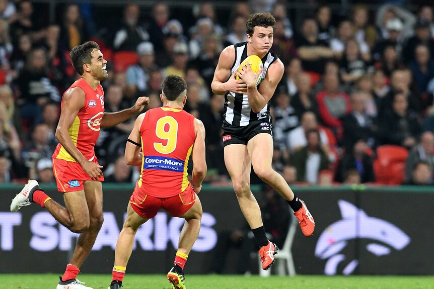 Collingwood player Flynn Appleby takes a mark