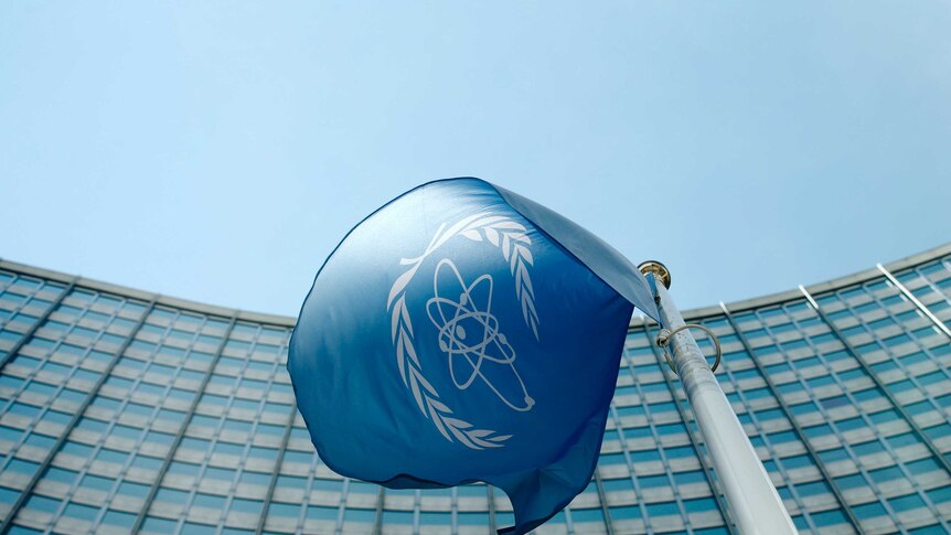 The IAEA flag flies in front of its headquarters in Vienna