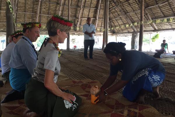 Australia's foreign minister taking part in a traditional welcome in Kiribati