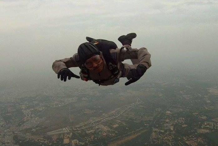 Arun Marwaha skydiving facing camera before parachute opens