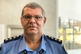 Aboriginal man in blue police uniform