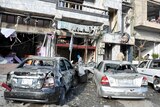 The aftermath of a double suicide bomb blast that targeted an army checkpoint in Homs.
