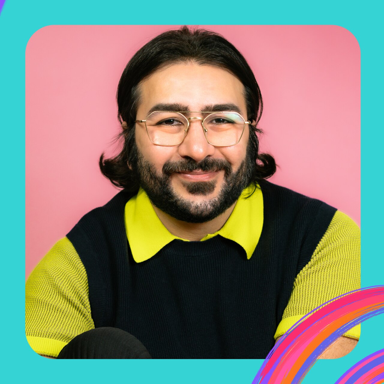 HOSSEI wears big wire-framed glasses, a black vest over a neon yellow shirt. He is smiling and has a dark beard.