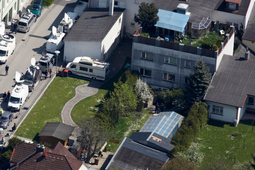 aerial view of a suburban house and yard 