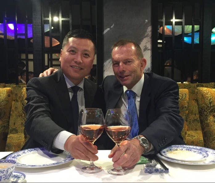 Haha Liu poses for the camera with former prime minister Tony Abbott at an event.