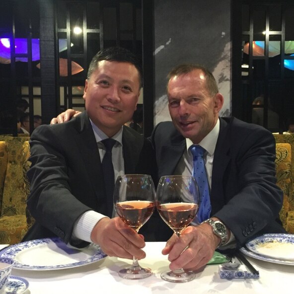 Haha Liu poses for the camera with former prime minister Tony Abbott at an event.