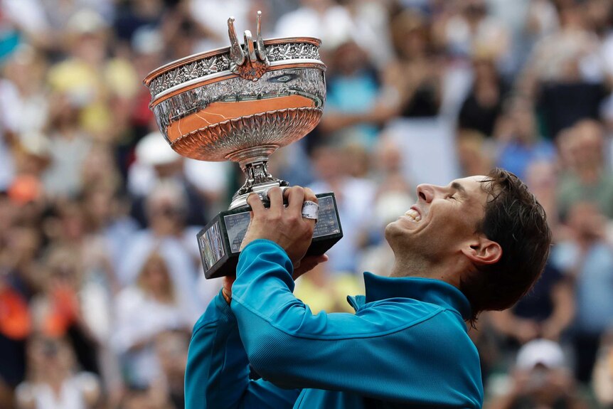 Rafael Nadal lifts the French Open trophy after beating Dominic Thiem in the final at Roland Garros