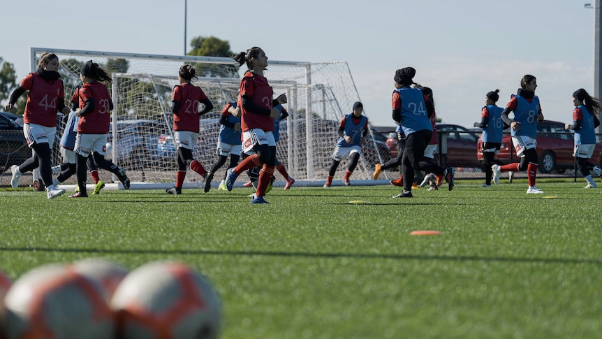 Afghan refugee women's team doing drills at training